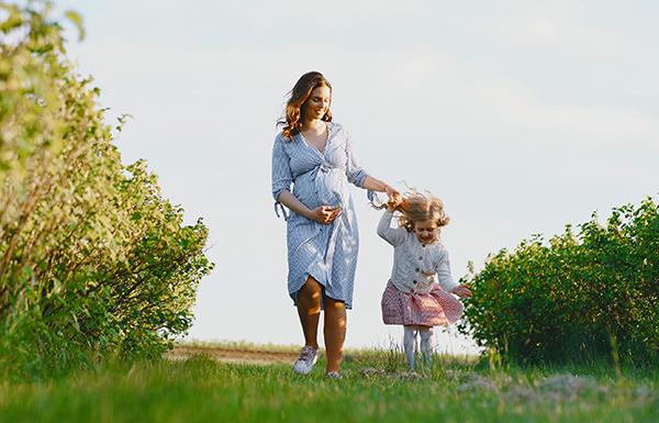 Pregnant woman with baby